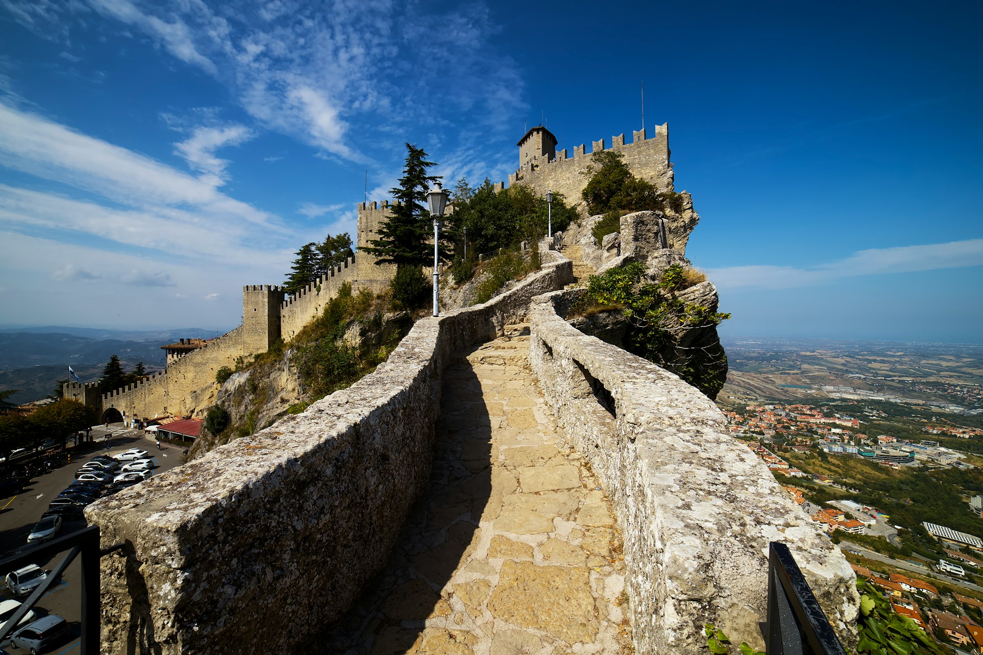 gray concrete castle near body of water during daytime